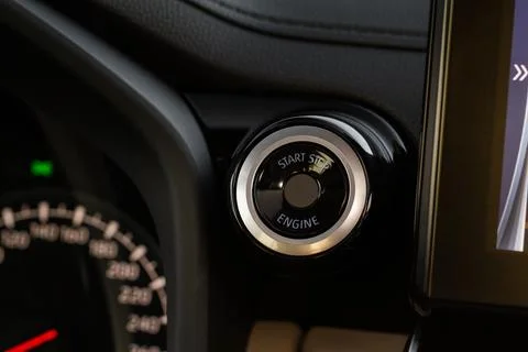 Engine start button with fingerpint close up. Car engine start button. Stock Photos