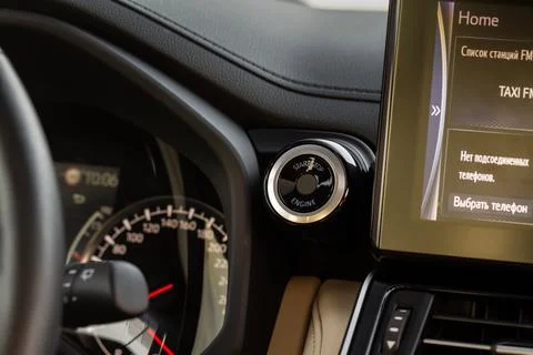 Engine start button with fingerpint close up. Car engine start button. Stock Photos