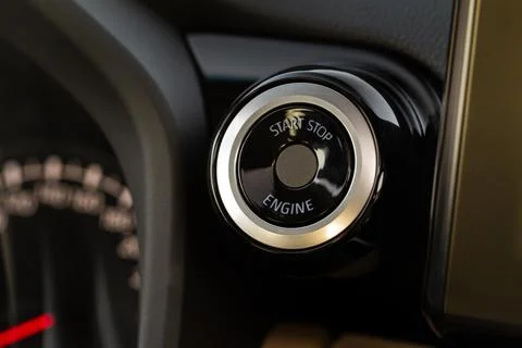 Engine start button with fingerpint close up. Car engine start button. Foto stock