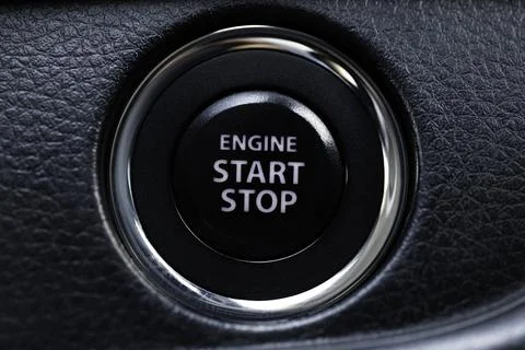 Engine start stop button of a car, macro close up short. Stock Photos