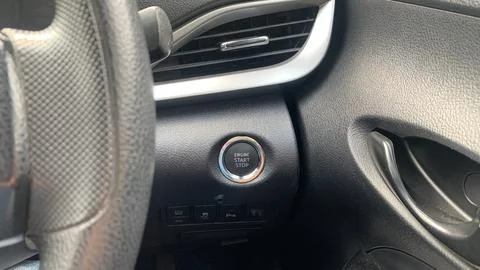 Engine start stop button located beside air vent Stock Photos