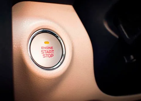 Engine start / stop button of luxury car. Stock Photos