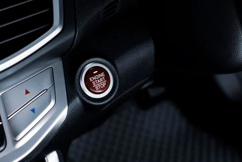 Engine start / stop button of luxury car, automotive part concept. Stock Photos