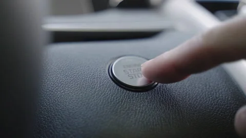 Engine start stop button from a modern car interior. Start car engine by pushing Stock Footage 150085625