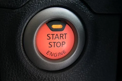 Engine start stop button from a modern car interior Stock Photos