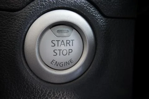 Engine start stop button from a modern car interior Stock Photos