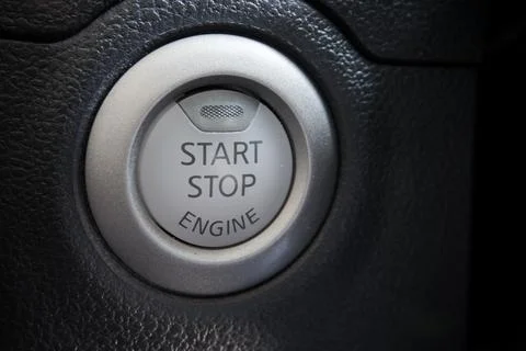 Engine start stop button from a modern car interior Stock Photos