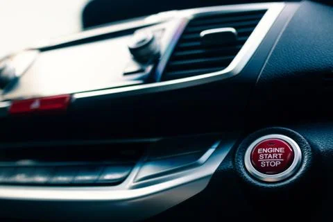Engine start/stop button in modern car, filter effect, selective focus Stock Photos