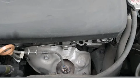 Engine startup close-up with mechanical sounds as the motor ignites and begins Stock Footage 323250086