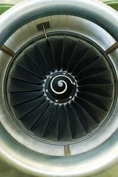 Engine turbine viewed up close, showcasing intricate design and engineering.. Fotos de archivo