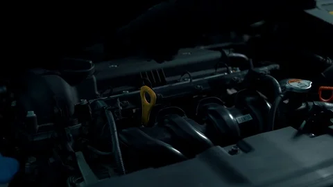 Engine under the hood of a car, black background Stock Footage 102665207