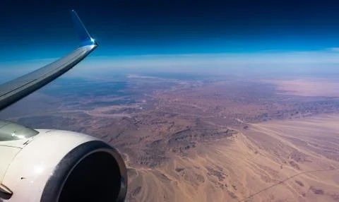 Engine Wing airplane sky concept. View of engine plane from window airplane s Stock Photos