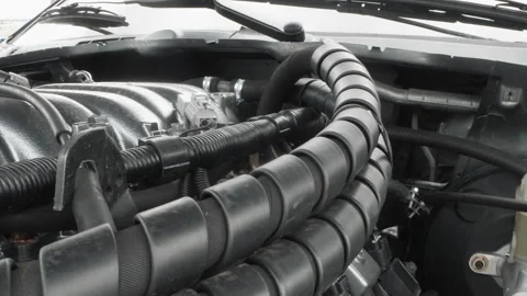 Engine wiring protected by spiral loom on polished intake manifold. Detailed Stock Footage 341972204