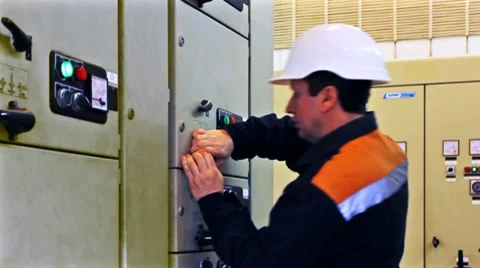 Engineer Activates Equipment Closeup 動画素材 10790343