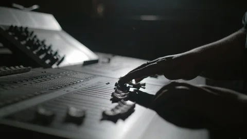 Engineer Adjusts Levels on Audio Mixing Desk 스톡 동영상 93111493