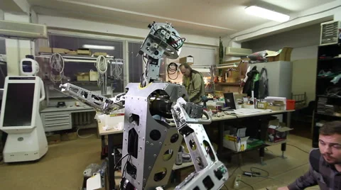 Engineer adjusts the robot Stock Footage 62023258
