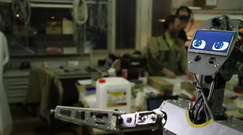Engineer adjusts the robot Stock Footage 62023313