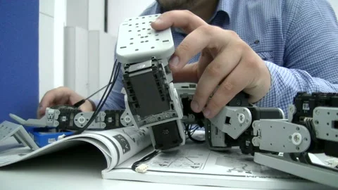 Engineer adjusts the robot Stock Footage 85506500