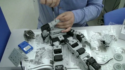 Engineer adjusts the robot Stock Footage 85506642