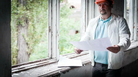 The Engineer Adjusts Working Drawings Stock-Footage 30441421