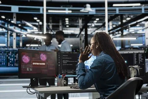 Engineer in AI server hub panicked by hacker attack stealing data Stock Photos