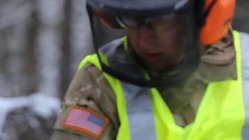 Engineer with Alaska National Guard using chainsaw Stock Footage 85719712