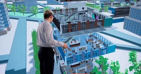 Engineer Analyzes Complex 3D BIM Design On Computer For Urban Construction Pl 写真素材