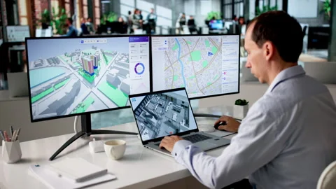 Engineer Analyzes Urban Property Maps Using BIM Stock Footage 334926527