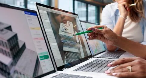 Engineer And Architect Collaborate On 3D BIM Model Using Laptop Software. Stock Photos