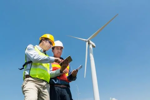 Engineer and Architect discuss over Digital Wireless Tablet and Clipboard Stock Photos