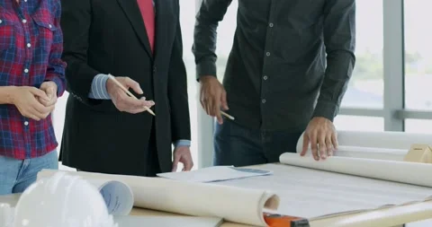 Engineer and architect manager wearing face mask planning on table Stock Footage 139956560