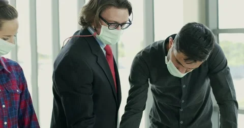 Engineer and architect manager wearing face mask planning on table Stock Footage 140031840