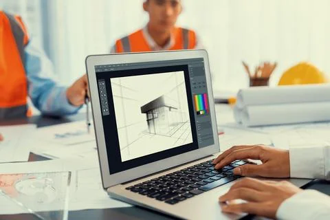 Engineer and architect using architect designing software together. Insight Stock Photos