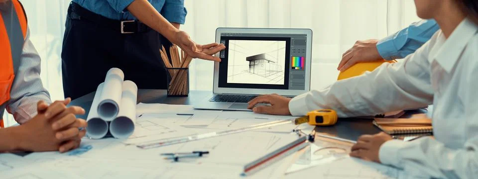 Engineer and architect using architect designing software together. Insight Stock Photos