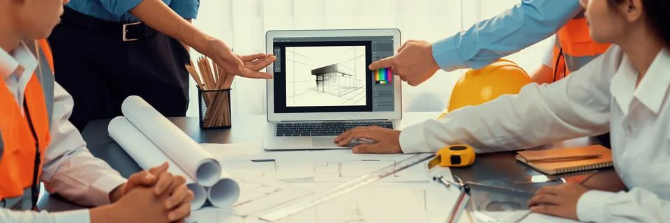 Engineer and architect using architect designing software together. Insight Stock Photos