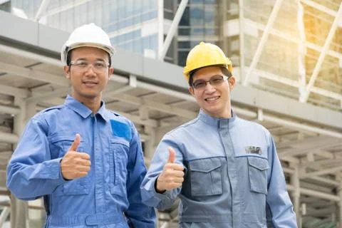 Engineer and Architect working at Construction Site with blueprint Stock Photos