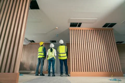 Engineer and architect working discussion plan in construction process interi Stock Photos