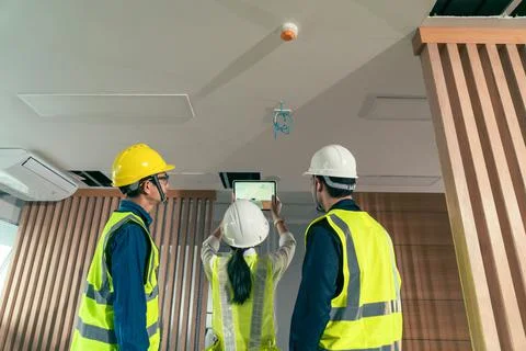 Engineer and architect working discussion plan in construction process interi 写真素材