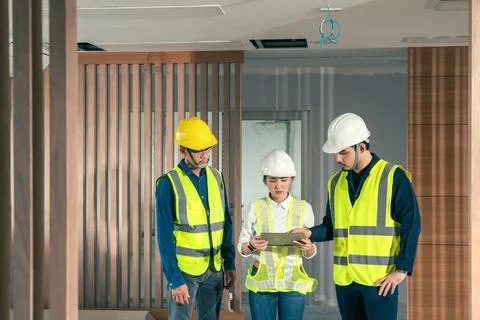 Engineer and architect working discussion plan in construction process interi Stock Photos