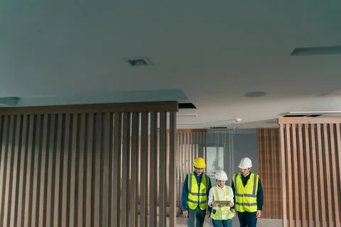 Engineer and architect working discussion plan in construction process interi Stock Photos