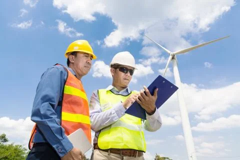 Engineer and Architect  working at Wind Turbine Power Generator Stock Photos