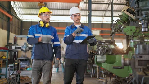 Engineer and boss checking machine Stock Footage 171377864