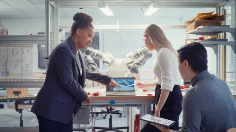 Engineer And Computer Scientists Analyse Robotic Arm Stock Footage 187558433