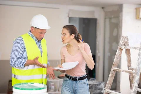 Engineer and designer disputing about signing contract Stock Photos