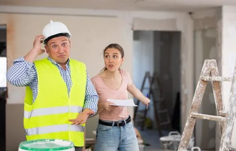 Engineer and designer disputing about signing contract Stock Photos