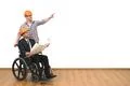 The engineer and disabled gesture on the white wall background Photo