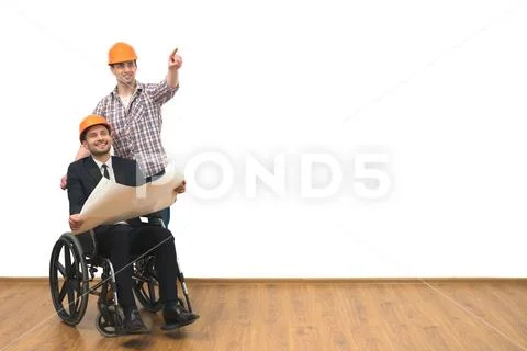 The engineer and disabled gesture on the white wall background Stock Photos