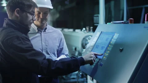 Engineer and Factory Worker are Setting Up CNC Lathe Machine Together 스톡 동영상 47913290
