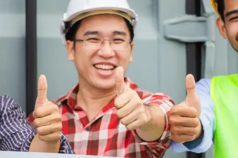 Engineer and factory worker man team smiling with giving thumbs up Фото