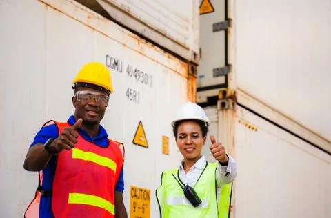 Engineer and factory worker team smiling with giving thumbs up Fotos Stock